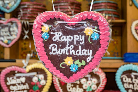 Colorful gingerbread sweetheart bearing the inscription Happy birthdayの写真素材