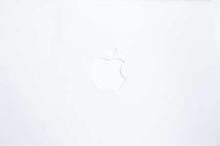 Monochromatic white Apple logo on white plastic background. Frankfurt, Germany - October 22 2016のeditorial素材
