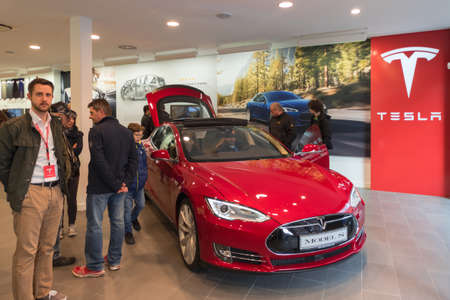Red Tesla electric car in the promotion showroom. Nuremberg, Germany - March 26 2016のeditorial素材