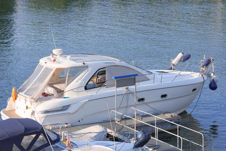 White pleasure motorboat at the pierの写真素材