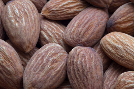 Whole shelled almonds as food backgroundの写真素材