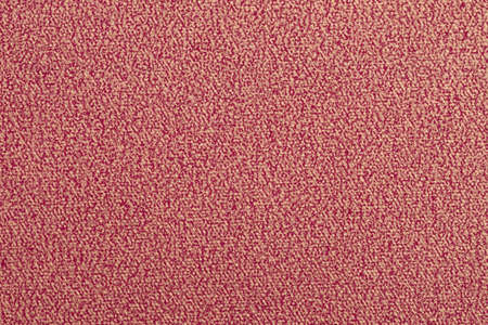 Ruby-red paper background with painted golden patternの写真素材