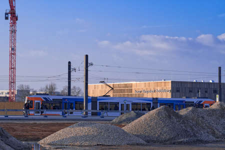 Construction site and the new tram line in the Heidelberg district Railway city with the modern building of the Luxor cinema in the background. Heidelberg, Germany - February 18 2018.のeditorial素材