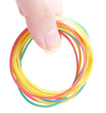 colorful rubber band in hand on white background