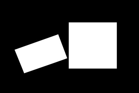 two white note paper on black backgroundの写真素材