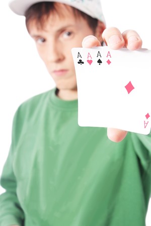 Man with playing cards in hand: four aces (isolated)