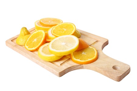 citrus on cuting board. white background の写真素材