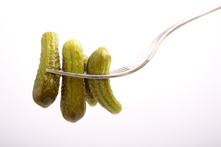 Marinated cucumber on fork  の写真素材