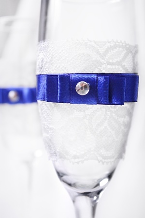 glasses with blue ribbonの写真素材