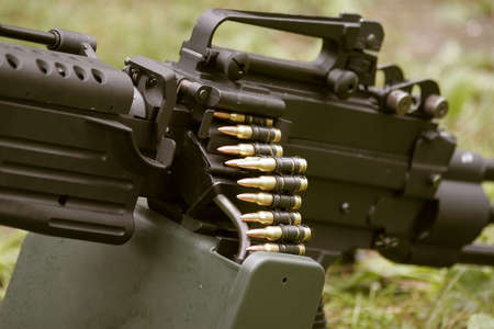 Gas-operated, air-cooled, belt-fed, automatic machine gun