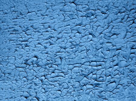 old peeling paint on wooden background. Classic blue color. Copy space