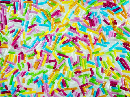 Macrophoto. Abstract bright holiday background for your projects. Multi-colored sprinkles. For children, confectionersの写真素材