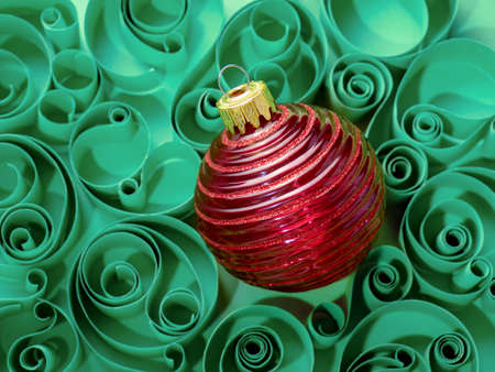New year's background, Christmas decorations. Christmas ball on the background of a paper pattern....