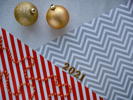 Christmas decors 2021. Geometric lines, Christmas balls and beads. Top view, copy space, place for...