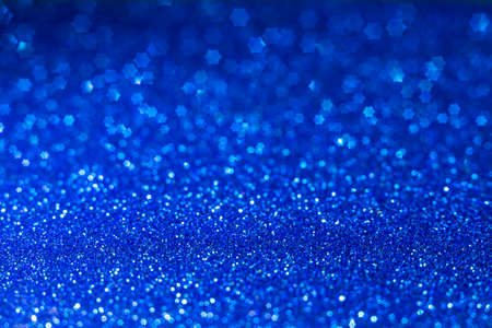 Golden lights in the shape of stars for a festive background. Abstract, bright background, blurred...