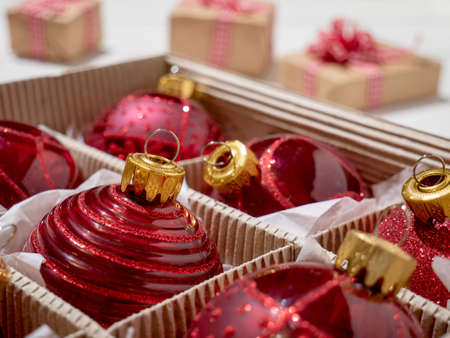 Christmas box with red Christmas balls and gifts, Christmas trinkets.の写真素材