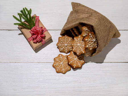 christmas decorations, box gift, ginger cookies glazed with powdered sugar in a bag. new year's gifts.の写真素材