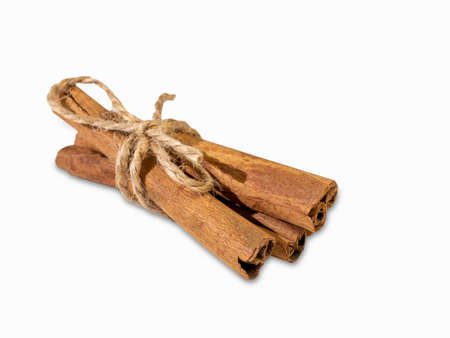 Fragrant cinnamon sticks isolated on a white background close-up. Oriental spices.