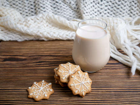 Traditional Christmas drink made of eggnog with cinnamon and ginger cookies. Cookies and milk