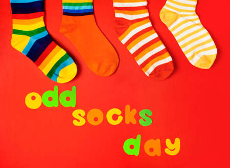 Odd Socks Day. Lonely Sock Day. The social problem of bullying. Strange socks as a symbol of Down syndromeの写真素材