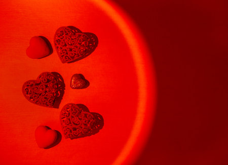 The concept of Valentines Day. The symbol of love is a heart in a circle of bright red color. Place...