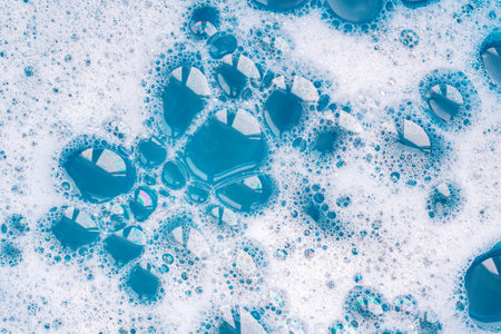 white soap foam. The texture of soap bubbles in close-up. Bubble bath. Gel for washing or washing hands. concepts of hygiene, cosmetics.の写真素材