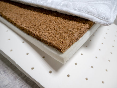Different layers of mattress filler. Coconut coir, polyurethane foam, foam rubber, cotton mattress materials. Manufacture of furniture, mattress materials.の写真素材