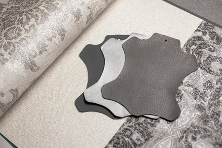 Artificial leather in black and white shades and paper wallpaper for apartment and house renovation. Minimalist monochrome home design.の写真素材