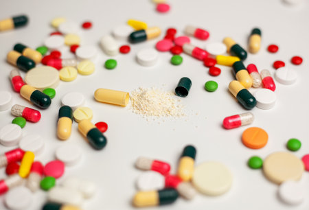Colorful tablets and capsules on a light background. The concept of medical care. Pharmaceutical preparations for the treatment of sick patients. selected focusの写真素材