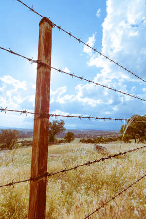 A rusty fence in a field near to Madrid