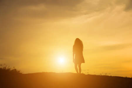 Young woman raise hands up for her success, Concept of Success in life.の写真素材