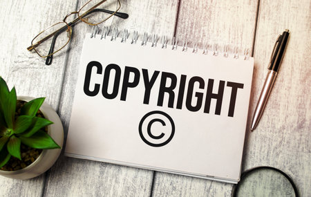 concept word Copyright on notepad and office suppliesの写真素材