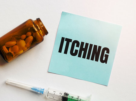 itching word with syringe and pillsの写真素材