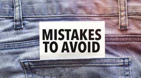 Mistakes To Avoid words on white card and jeans pocketの写真素材