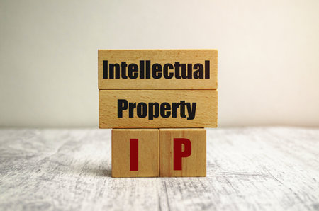 On the wooden blocks with the inscription - intellectual propertyの写真素材
