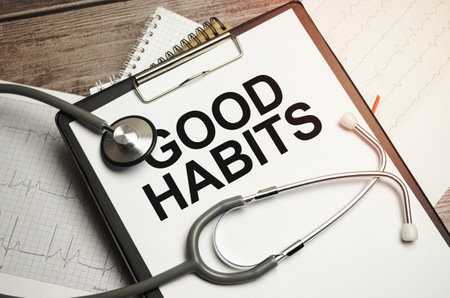 Good Habits text on notebook with pen, stethoscope and cardio charts on wooden backgroundの写真素材