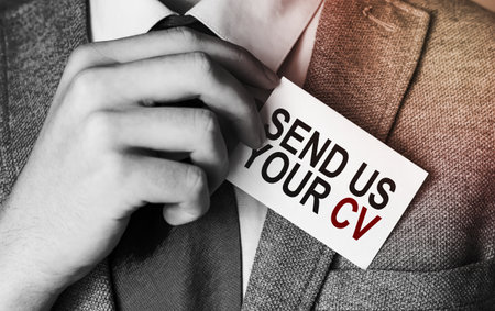 send us your cv on business card on pocketの写真素材