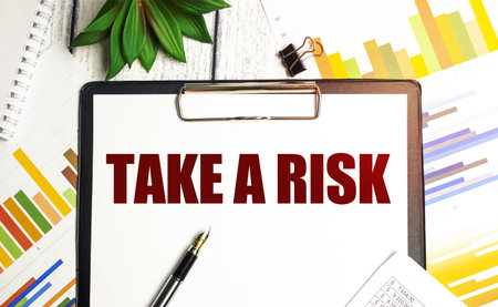 Word text TAKE A RISK on white paperの写真素材