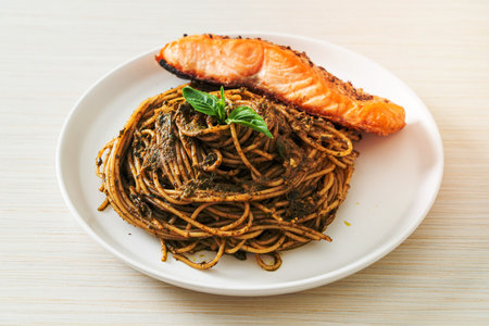 homemade pesto spaghetti pasta with grilled salmon - Italian food styleの写真素材