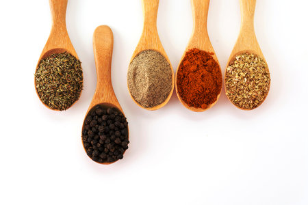 Spices and herbs on white background
