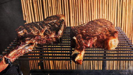 Lamb ribs are cooked on the grill for serving in catering.の写真素材