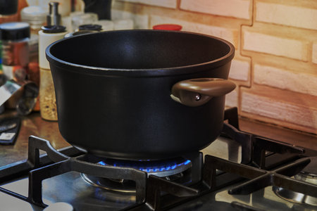 Pot with cooking food in the kitchen on gas stove.の写真素材