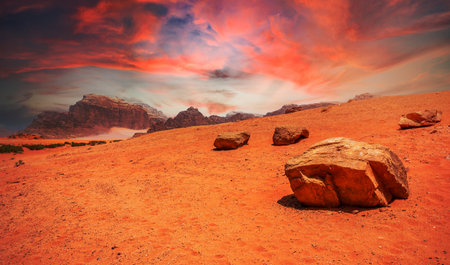 Red sky, sands and stones of Wadi Rum desert, Jordanの写真素材