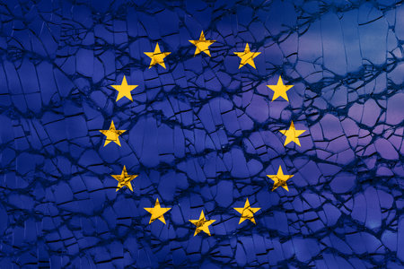 flag of European Union EU with shattered or cracked glass texture - europe crisis breakup or disintegration conceptの写真素材