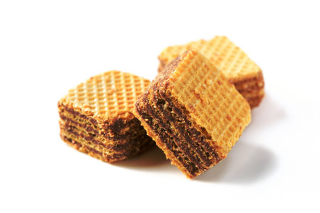 square chocolate wafer biscuits isolated on white background, bakery and snack conceptの写真素材