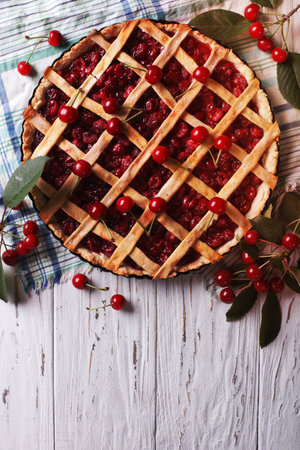 American homemade cherry pie on the table. vertical top viewの写真素材