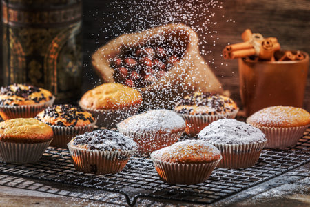 Falling powder sugar on vanilla muffinsの写真素材