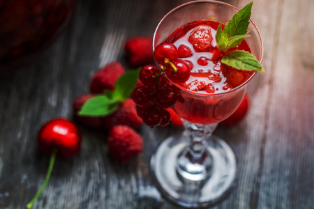 Closeup of liqueur made of fresh wild berries and mintの写真素材