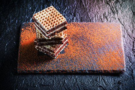 Homemade wafers with chocolate and hazelnut on stone plateの写真素材