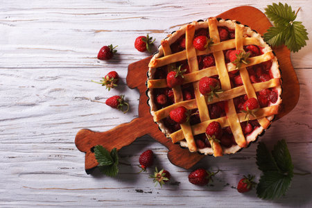 homemade strawberry pie on a table. horizontal view from above, rustic styleの写真素材